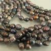 Невероятно красивое ожерелье из черных жемчужин различных оттенков Таити