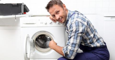 plumber_fixing_broken_washing_machine_1.jpg